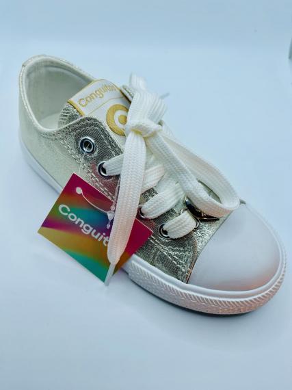 Foto tenis conguitos dorados