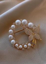 Broche con perlas